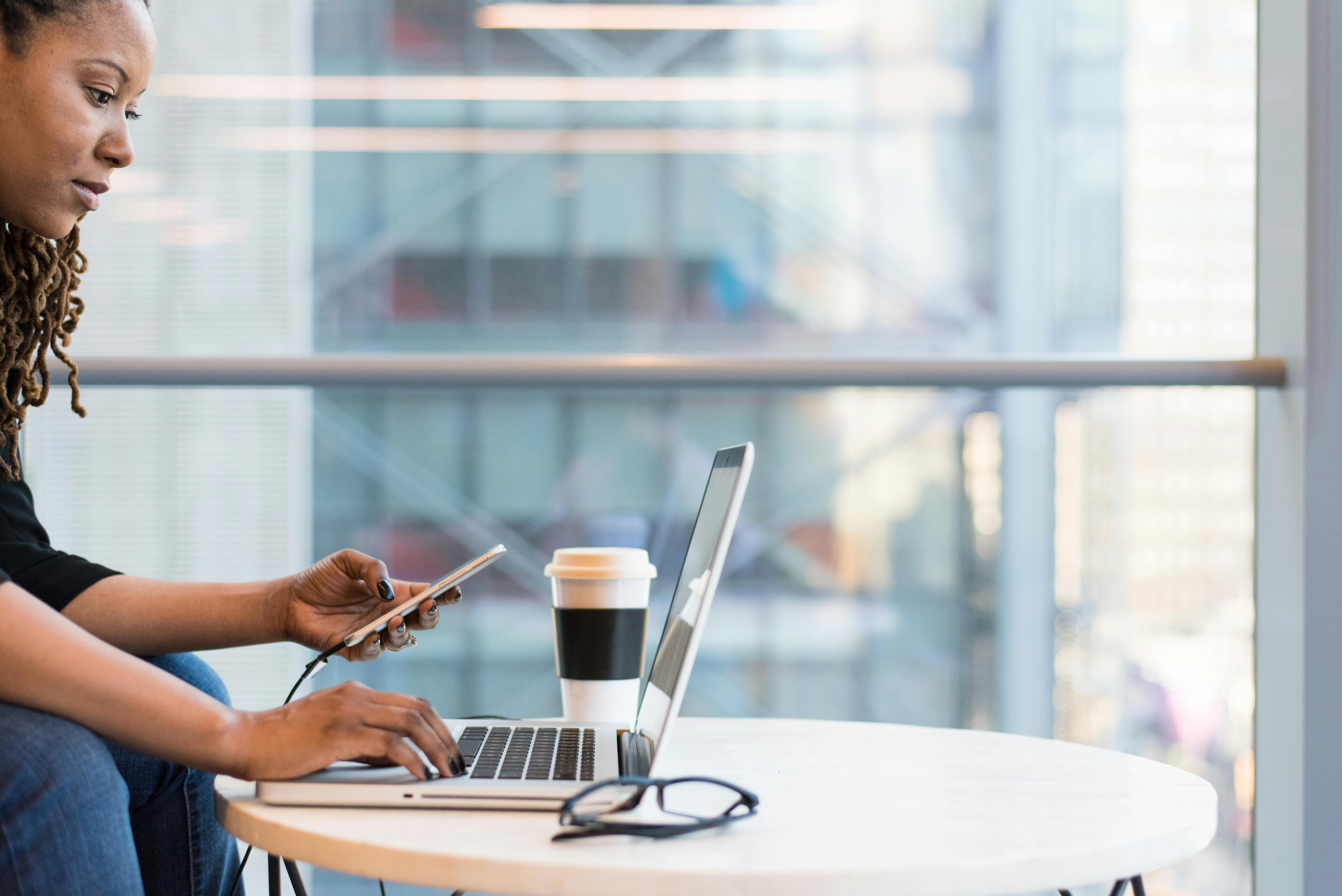 woman typing on laptop