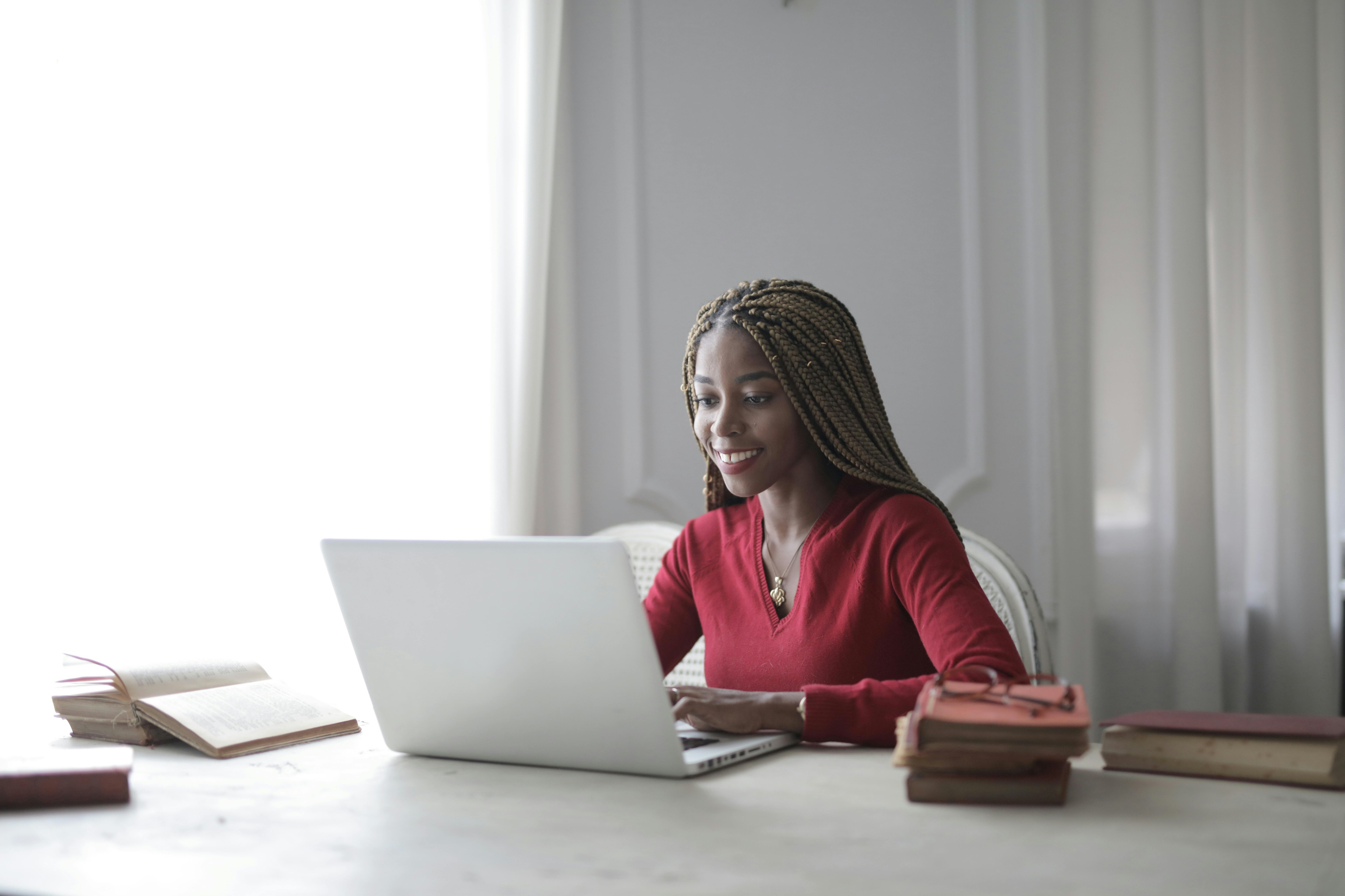 woman typing on laptop